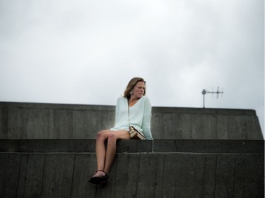 Jandra Drodge sits on the wall of the Canadian War Museum by the Blacksheep Stage at Bluesfest Sunday July 10, 2016.