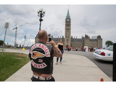 Kalie (who didn't provide a last name) from Fort McMurray, Alberta pauses for a photo on Parliament Hill July 23, 2016.