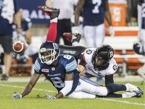 The Toronto Argonauts' Kenny Shaw has a pass attempt broken up by Ottawa Redblacks linebacker Antoine Pruneau in a game on July 13, 2016. The number of penalties against Ottawa on pass plays has frustrated defensive backs coach Ike Charlton: “For me, personally, they have a hard time officiating us because we’re pretty much the only team in the CFL which plays an aggressive style of defence."