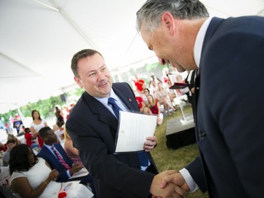 L-R: Olimpiu Samsodan at the Canadian Citizenship ceremony held on Canada Day at the Bytown Museum in Ottawa, Friday, July 1, 2016.