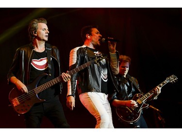 Duran Duran lead singer Simon Le Bon, centre, bassist John Taylor, left, and guitarist Dominic Brown perform on the City stage.