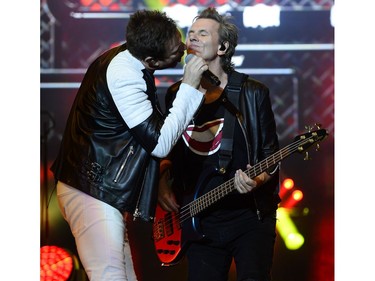 Duran Duran lead singer Simon Le Bon, left, and bass player John Taylor perform on the City stage.