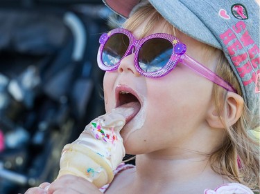 Leah MacKenzie, 2 1/2, enjoys a cone as the National Ice Cream Day is celebrated at the Ice Cream Festival taking place Sunday at the Canada Agriculture and Food Museum.