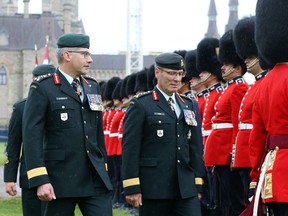 Lieutenant-General P.F. Wynnyk (L) and Lieutenant-General J.M.M. Hainse (R) were part of the inspection of the Geremonial Guard during the change of command ceremony for the Canadian Army on Parliament Hill in Ottawa, July 14, 2016.