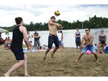Local DJ David Deez from team Pub 101 makes a save during the 34th edition of Hope Volleyball Summerfest.