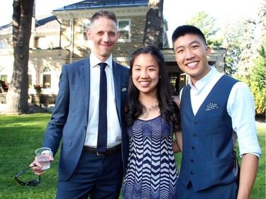 Marc Stevens, general manager of the National Arts Centre Orchestra, with pianist Silvie Cheng and her brother, cellist Bryan Cheng, both of whom performed as the Cheng Duo at a garden party in support of the Friends of the NAC Orchestra, hosted by the Italian ambassador at his official residence in Gatineau on Tuesday, July 5, 2016.
