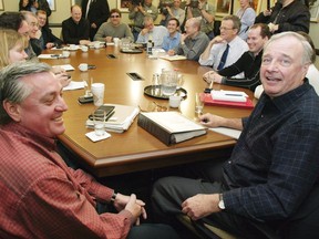 Liberal Leader Paul Martin (right) holds a meeting with head of his transition team, Mike Robinson (left), in Ottawa on Friday November 21, 2003. A high-profile organizer and supporter of former prime minister Paul Martin has died.The Liberal Party of Canada confirmed Friday that Mike Robinson died in Normandy, France. He was 67.