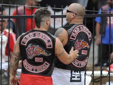 Members of a Hells Angels support club greet each other outside the Hells Angels Nomads compound during the group's Canada Run event in Carlsbad Springs, Ont., near Ottawa, on Saturday, July 23, 2016.