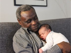 Mohammed Adam with his grandchild, Nyla. (Photo courtesy of the family.)