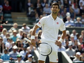 Novak Djokovic of Serbia gestures during his men's singles match against Sam Querrey of the U.S on day six of the Wimbledon Tennis Championships in London, Saturday, July 2, 2016.