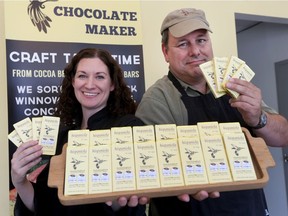Chocolate makers Erica and Drew Gilmour pose with their number one chocolate bar in the world.