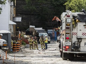 Ottawa firefighters at the scene of a gas leak in a construction zone on Perkins Street near Albert Street in Ottawa.