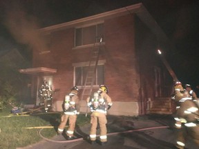 Ottawa firefighters operate at a second-alarm fire at 1215 Trenton Ave. on Friday, July 22, 2016.