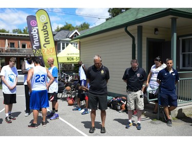 During the Naqvi Cup, Ottawa police Chief Charles Bordeleau, centre, participates in a moment of silence for the recent death of Abdirahman Abdi.