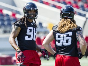 Ottawa Redblacks defensive linemen, Paul Hazel, 98, and Aaron Karlen, 96, new additions to the team, are photographed during practice at TD Arena Wednesday July 27, 2016.