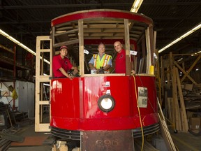 Ottawa streetcar 696, built in 1917, is being rebuilt. Volunteers Teddy Dong, Paul Bruyere and Rheaume Laplante hope to have the car ready and operational by Canada Day 2017.