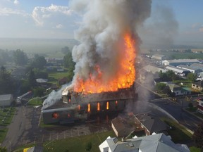 The Catholic church in St. Isidore goes up in flames on Saturday, July 23, 2016.