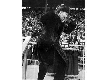 Pierre Trudeau celebrates during 1976 Grey Cup game in Toronto.