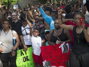 Protesters rally at Washington Park on Sunday, July 10 in Cincinnati. Hundreds of people gathered for a Black Lives Matter rally in Cincinnati following the fatal shootings of black men by police in Louisiana and Minnesota in the past week.