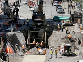 Day 7: Repair work continues on the sinkhole at Rideau near Sussex in downtown Ottawa.