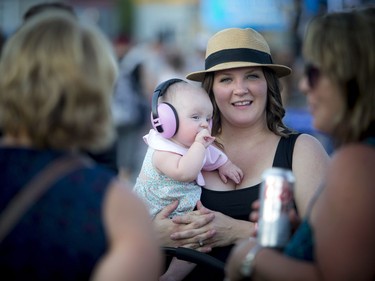 Seven month old Scotlynn Dekoning and her mom Brittany Dekoning at Bluesfest at LeBreton Flats Thursday July 7, 2016.