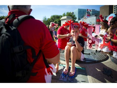 Seven year old Jordan Rog enjoys a bowl of ice cream on Canada Day downtown Ottawa Friday July 1, 2016.