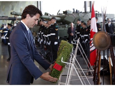 Prime Minister Justin Trudeau, lays a wreath in commemoration of the 100th anniversary of the Battles of the Somme and Beaumont-Hamel, at the National War Museum in Ottawa, Friday, July 1, 2016.