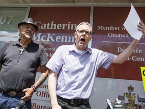 Stop Windmill spokesperson Kevin Skerrett speaks to about 20 people gathered in front of Liberal MP Catherine McKenna's office on Monday, July 18, 2016 to protest the Zibi development plan for Chaudière Island.