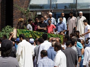 The casket is carried out of the Mosque following the funeral service for Abdirahman Abdi held at the Ottawa Mosque on Friday.