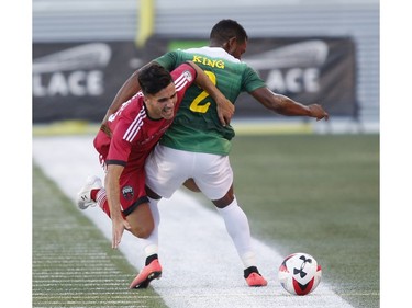 The Ottawa Fury's Mauro Eustaquio, left, and the Tampa Bay Rowdies' Darnell King collide.