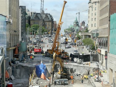 Day 6: The sinkhole on Rideau St., near Sussex Ave corner in downtown Ottawa Monday.