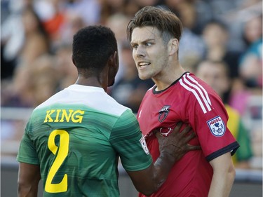 The Tampa Bay Rowdies' Darnell King, left, and the Ottawa Fury's Maxim Tissot argue during the first half.