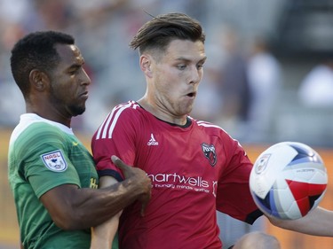 The Tampa Bay Rowdies' Darnell King, left, and the Ottawa Fury's Maxim Tissot eye the ball during the first half.
