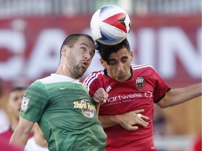 The Tampa Bay Rowdies' Joe Cole, left, and the Ottawa Fury's Mauro Eustaquio head the ball during the first half of their soccer match at TD Place on Saturday, July 30, 2016.