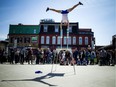 The warm weather brought buskers out in the Market Saturday April 16, 2016 including Joey Albert The Acrobat Guy.