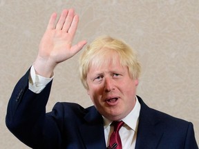 TOPSHOT - Brexit campaigner and former London mayor Boris Johnson waves after addressing a press conference in central London on June 30, 2016.