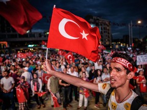 Pro-government supporters gather at Taksim Square July 20, during a rally in Istanbul following the failed military coup attempt of July 15.