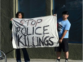 People in Los Angeles protest the fatal police shooting this week of two black men, Alton Sterling and Philando Castile.