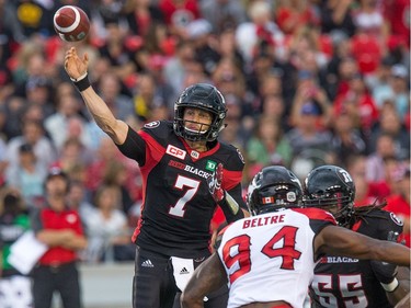 Trevor Harris throws a pass in the first quarter as the Ottawa Redblacks take on the Calgary Stampeders in CFL action at TD Place stadium.