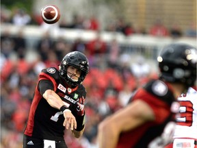 Ottawa Redblacks quarterback Trevor Harris (7) makes a pass during the first half of a CFL football game against the Calgary Stampeders in Ottawa on Friday, July 8, 2016.