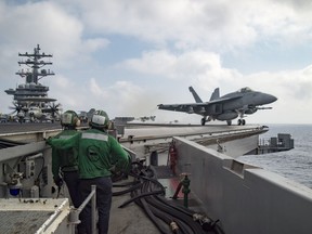 This US Navy photo shows SAn F/A-18E Super Hornet assigned to the Sidewinders of Strike Fighter Squadron (VFA) 86 as it launches from the flight deck of the aircraft carrier USS Dwight D. Eisenhower (CVN 69) in the Mediterranean Sea.