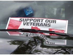 A sign is placed on a truck windshield as members of the advocacy group Banished Veterans protest outside the Veterans Affairs office in Halifax on Thursday, June 16, 2016. The group is protesting a decision to deny a decorated 94-year-old war veteran entry into the federally funded Camp Hill Veterans Memorial Hospital.