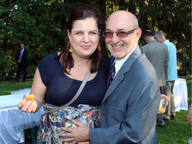 Violinist Jessica Linnebach, associate concertmaster with the National Arts Centre Orchestra -- nine-months pregnant with her second child -- was in safe hands with her physician, Dr. David Finestone, also present at the Italian garden party held Tuesday, July 5, 2016, for supporters of Friends of the NAC Orchestra.