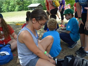 Miya Kachi. 11, packs away her kit after testing her sugar levels at 'D-Camp', a vacation camp for kids with diabetes.