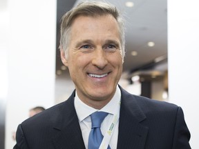 Files: Conservative MP Maxime Bernier shows off his "leadership pin" during the first day of the Manning Centre Conference in Ottawa on February 26, 2016.  (Chris Roussakis/