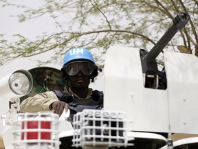 (FILES) -- A file photo taken on July 27, 2013 shows United Nations (UN) soldiers patrolling in the northern Malian city of Kidal. Two UN peacekeepers and a civilian contractor were killed in a rocket attack on November 28, 2015 on a UN base in northeast Mali, a week after a deadly siege at a Bamako hotel claimed by jihadists. "Our camp in Kidal was attacked early this morning by terrorists using rockets," said an official from the UN peacekeeping mission in Mali (MINUSMA), adding that two Guinean peacekeepers and a contractor working for the United Nations were killed. A local official confirmed the report.   AFP PHOTO / KENZO TRIBOUILLARDKENZO TRIBOUILLARD/AFP/Getty Images