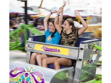 13-year-old friends Myja Juppe, left, and Meghan Twamley have a blast on the Scrambler ride at The Capital Fair taking place from August 19th to 28th at the Rideau Carleton Entertainment Centre. Tuesday August 23, 2016.