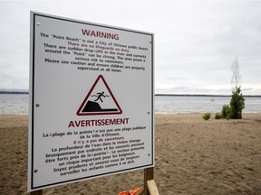 A new sign warns of the dangers of swimming in an area of water where a 10-year-old boy drowned recently.