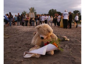 A teddy bear sits on the beach at Constance Bay on Sunday, August 14, 2016 during a vigil for Maleak Thompson, 10, who drowned at this location.