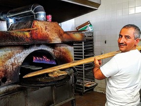 Lebanese pies on man’oushe flatbread pulled piping hot from the oven by Adul Faiszyar.